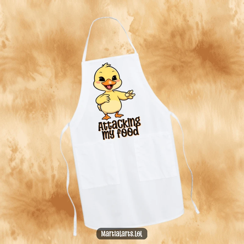 Funny giggling duck mimicking a martial arts move with its beak, featured on a durable chef's apron.
