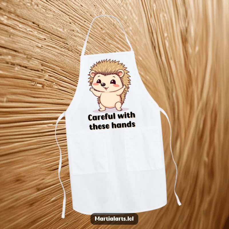 Funny apron depicting a hedgehog wobbling precariously while attempting a yoga pose, adding humor to the kitchen.