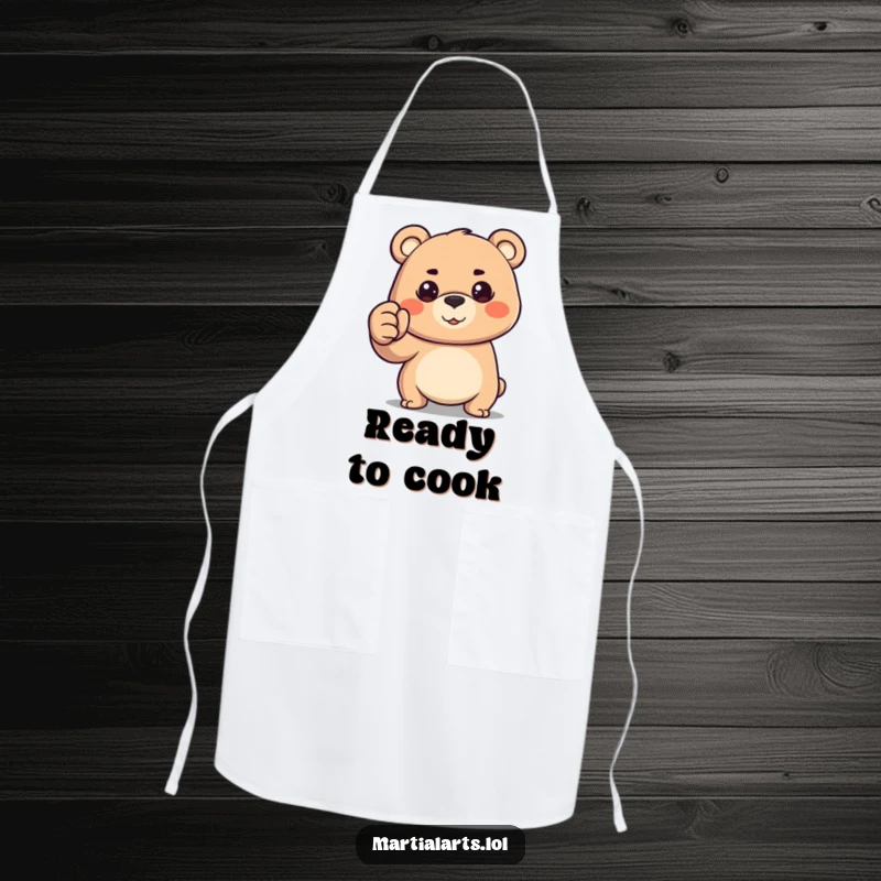 Funny happy bear with a determined gaze, forming a fist, featured on a durable chef's apron.