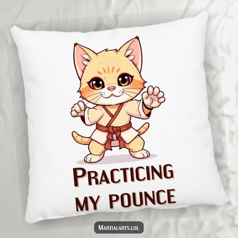 Funny curious kitten in a martial arts pose on a pillow, a cozy and humorous decorative accent for cat lovers.