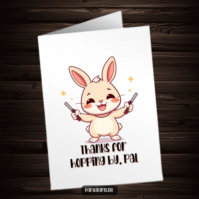 Funny Free Printable Thank You Card: A cheerful rabbit smiling widely while juggling nunchucks, expressing thanks.