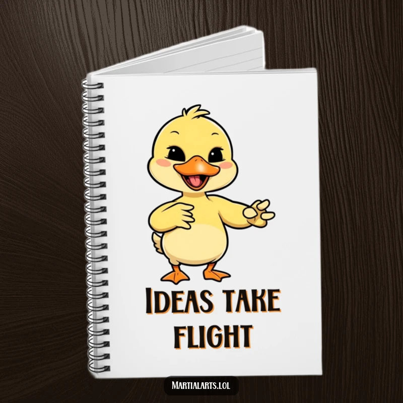 Funny duck with a giggle, mimicking a martial arts move with its beak, ready to 'strike' on this journal.