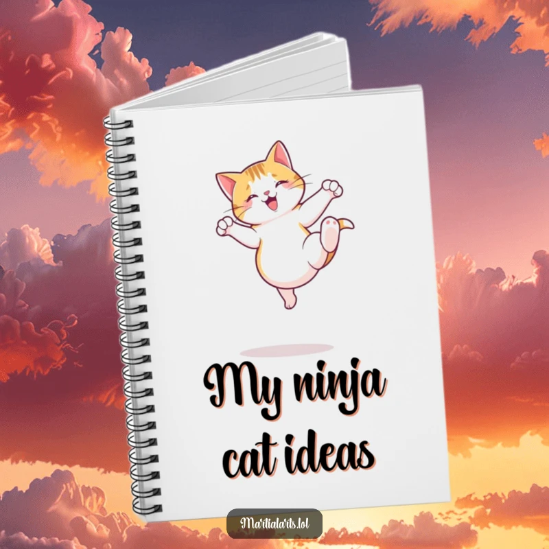 Funny Cat Notebook with a cover showing a jumping cat executing a playful roundhouse kick, ideal for jotting down agile ideas.